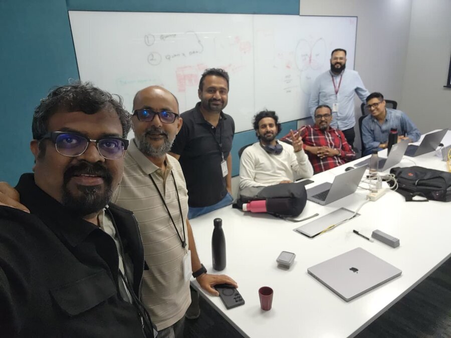 Selfie with colleagues in front of a whiteboard after a work session